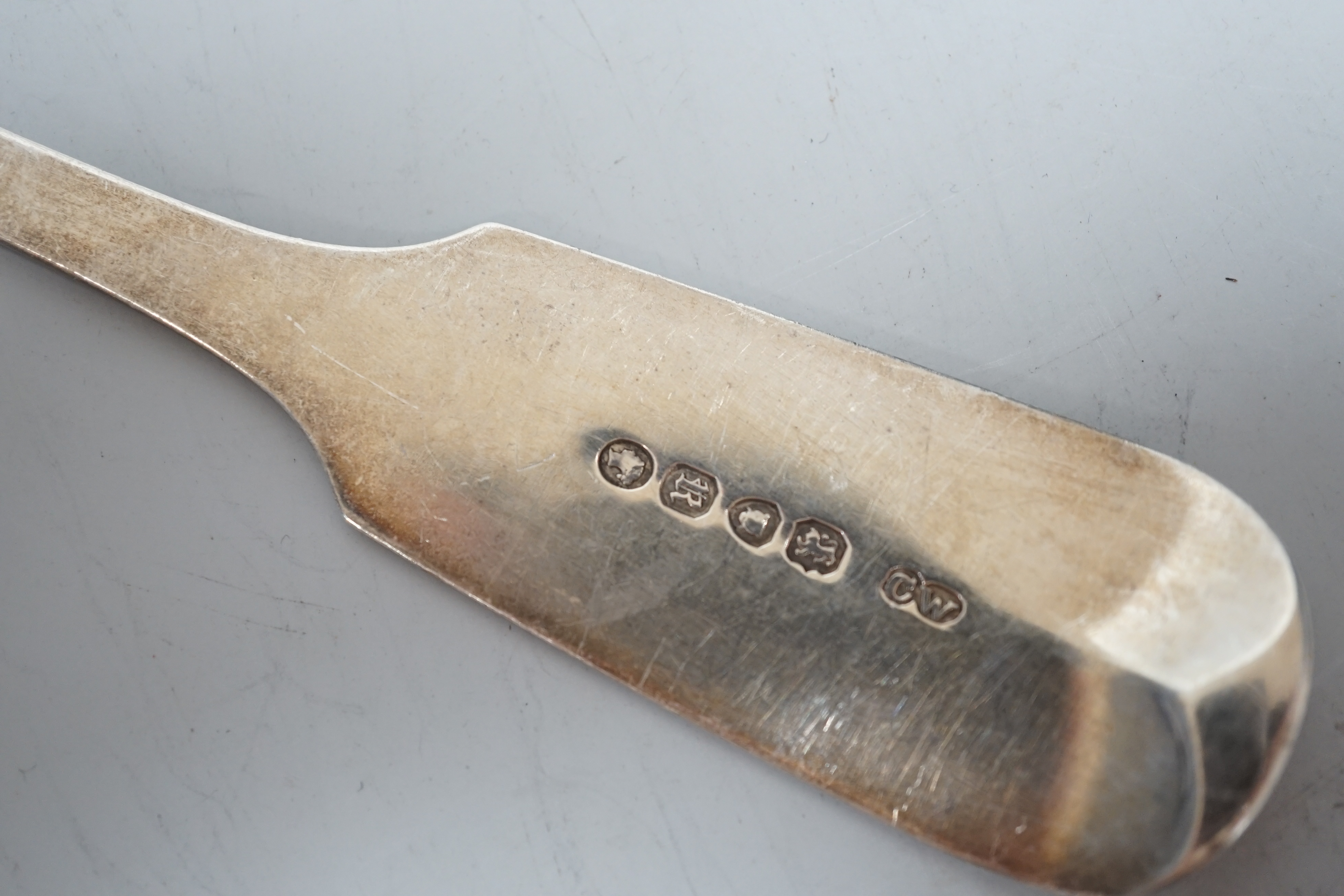 A Victorian silver fiddle pattern basting spoons, Charles Wallis, London, 1852, 30.4cm and a pair of Victorian provincial silver dessert forks, Josiah Williams & Co, Exeter, 1862, 7.6oz.